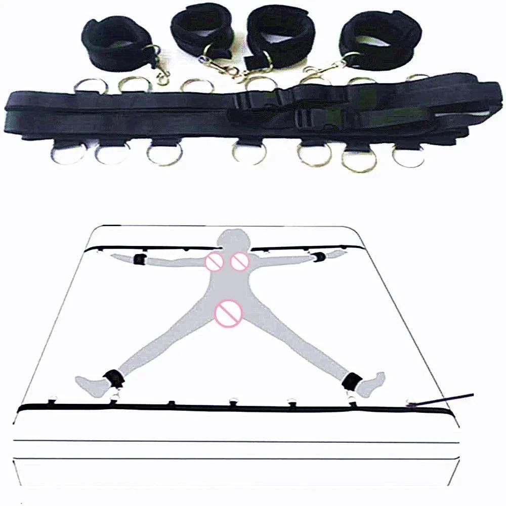 Full bed restraint tie-down set with adjustable straps, handcuffs, ankle cuffs, and eyeblinder for couples' bondage play.