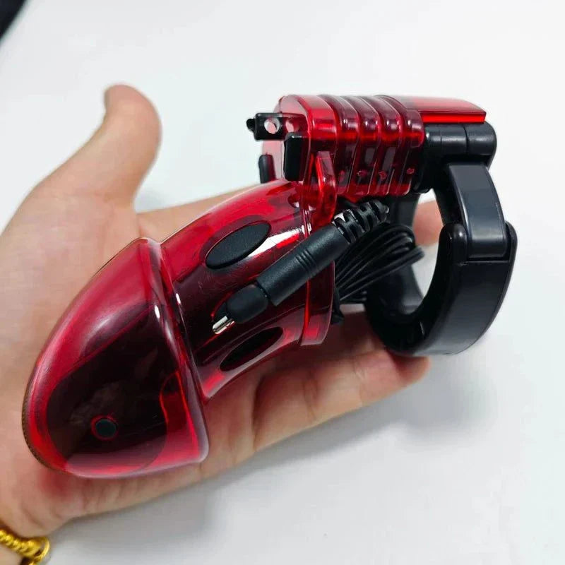 Electric Shock Penis Plug and Chastity Cage with urethral dilator in hand, red and black cock ring electro stimulator device