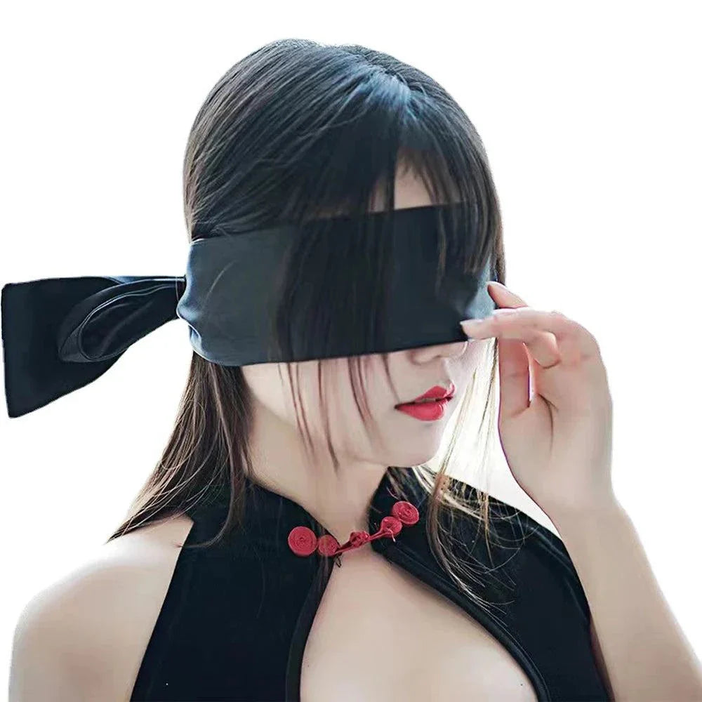 Woman wearing a black blindfold from Couples BDSM Bondage Set for intimate roleplay and bondage games