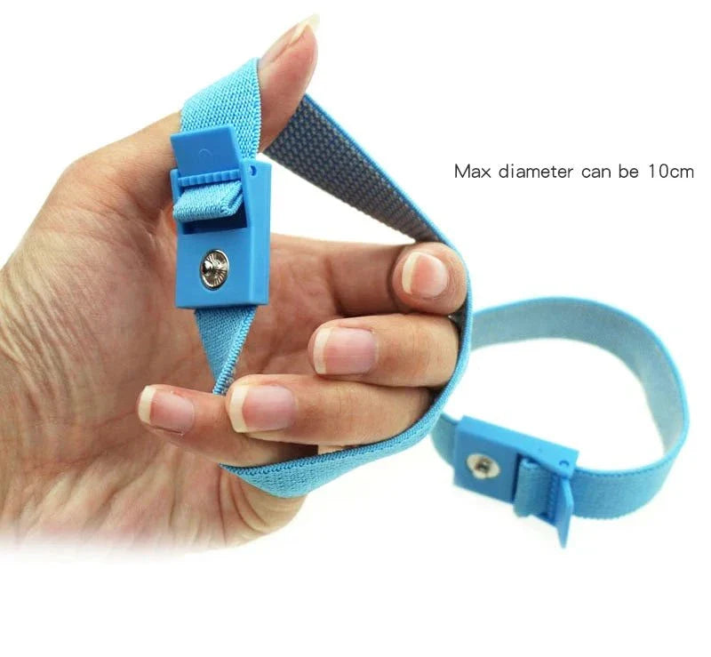 Adjustable blue electro shock conductive cock ring with elastic strap and safety buckle held in hand