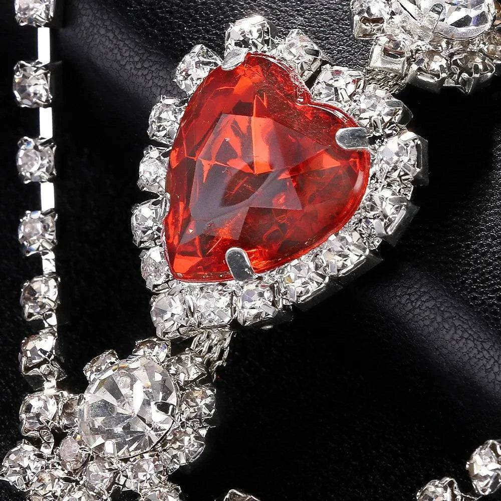 Close-up of Stonefans Red Heart Rhinestone Waist Chain featuring a red heart centerpiece surrounded by clear rhinestones on a silver multi-chain belt