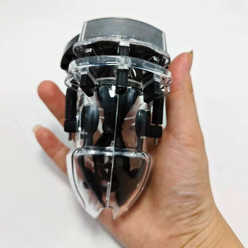 Electric shock penis plug chastity cage with urethral dilator and cock ring electro stimulator held in hand
