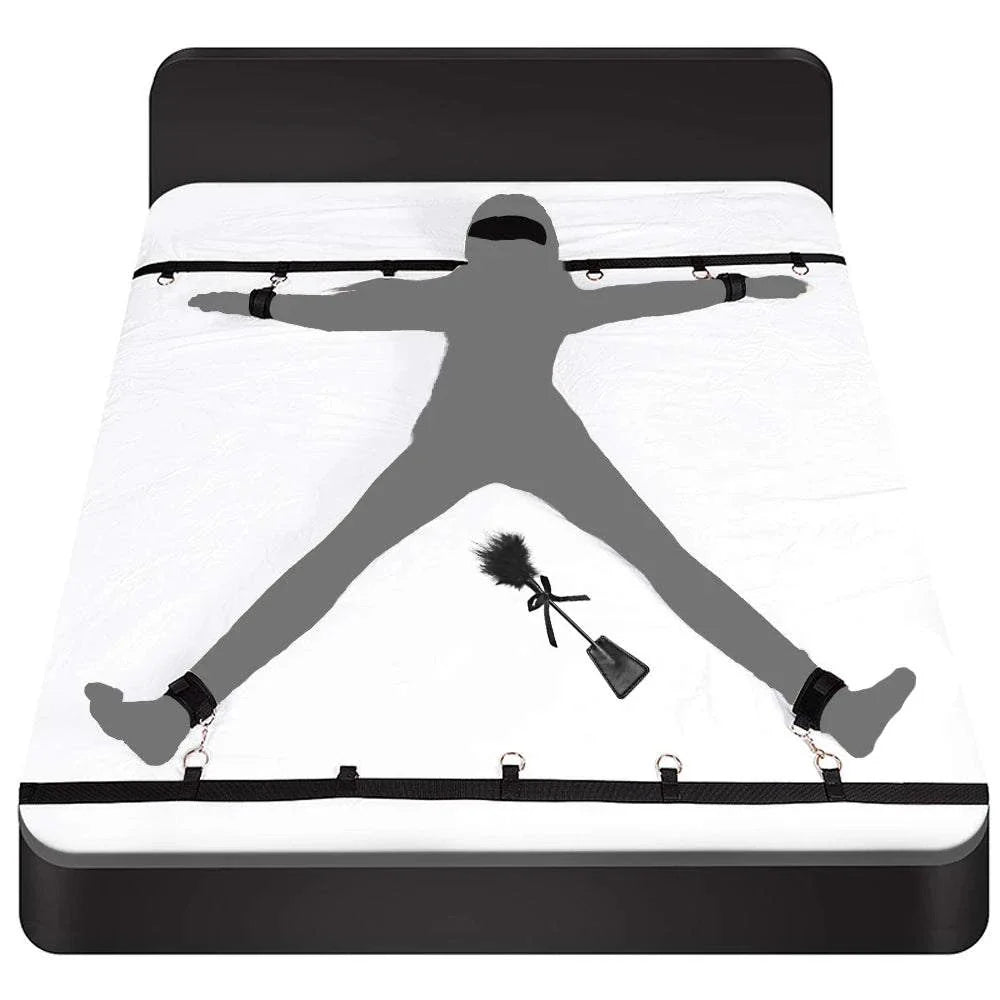 Couples BDSM Bondage Set with mask, feather tickler, handcuffs, and ankle restraints on bed restraint system