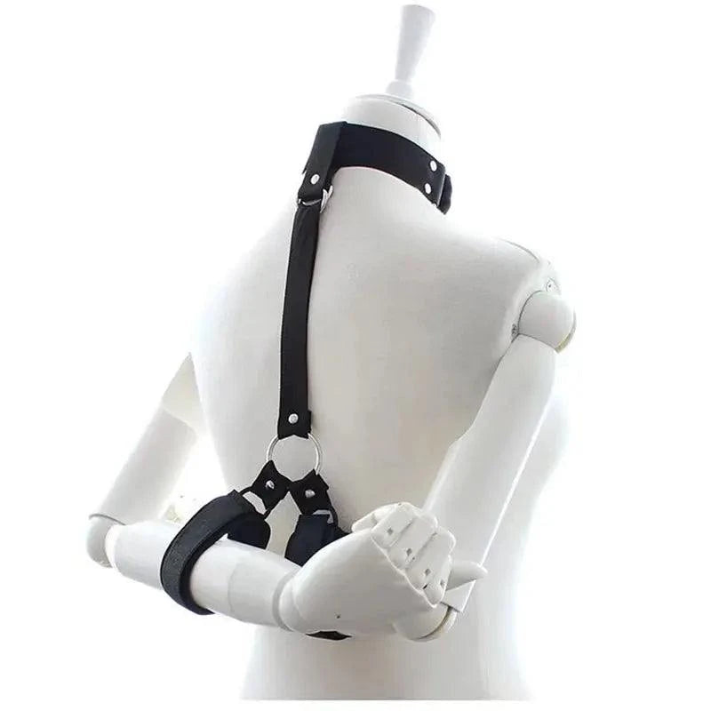 All-in-One 18-Piece Bondage & Strap-On Kit with adjustable harness and hand restraints on mannequin back
