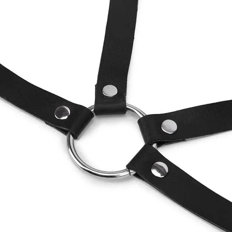 Close-up of adjustable strappy body harness belt with metal ring and rivets for lingerie or bondage look