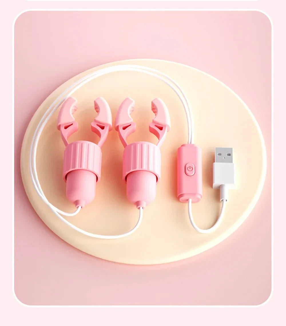 Pink USB rechargeable nipple clamps vibrator with remote control on beige background