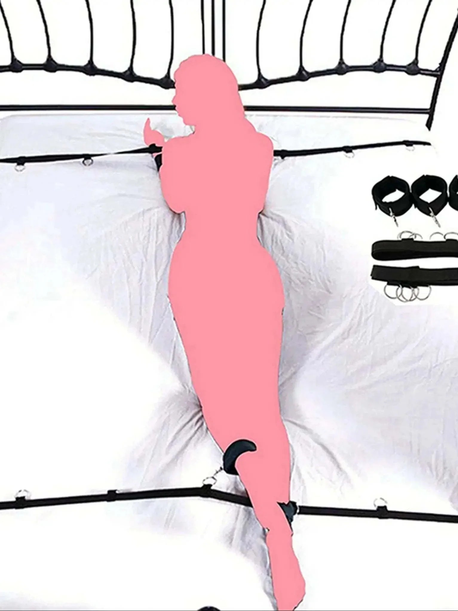 Full bed restraint tie-down set with adjustable straps, handcuffs, ankle cuffs, and eyeblinder on a bed.