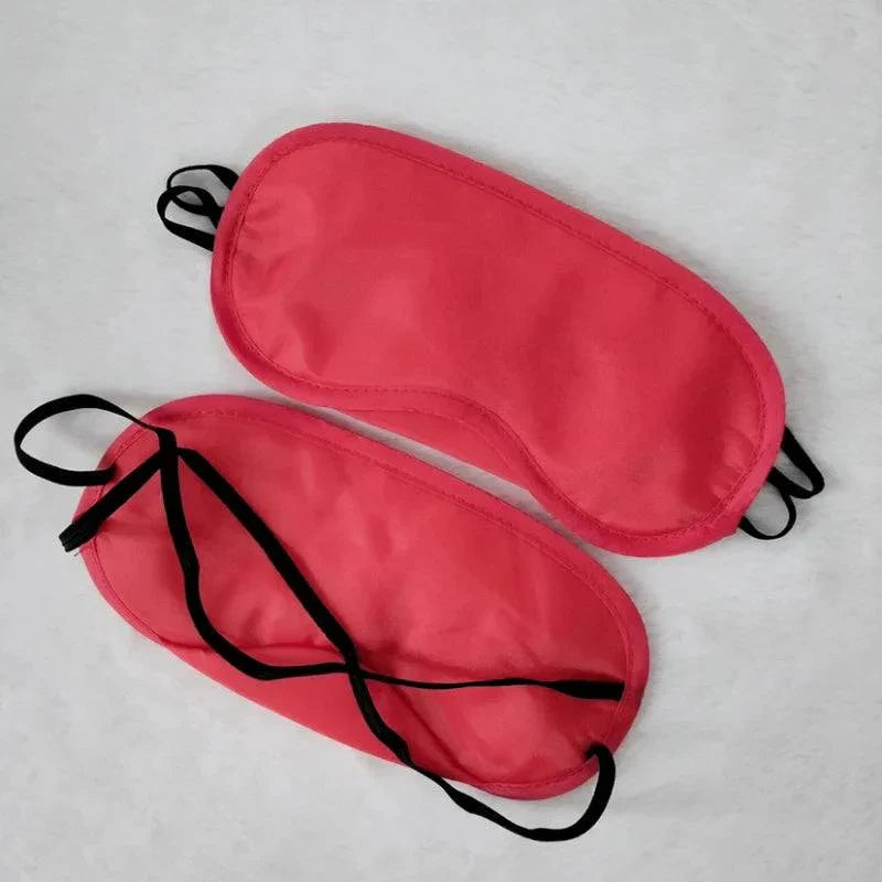 Red padded blindfolds with black straps for sensory play and bondage set