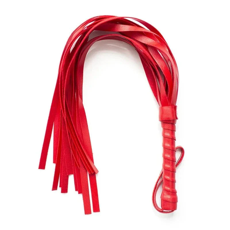 Red leather flogger whip with multiple tails for sensory play and bondage use