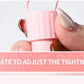 Close-up of pink nipple clamps vibrator being adjusted for tightness by hand