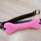 Soft harness mouth silicone dog-bone ball gag with adjustable black and pink strap restraint for bondage play