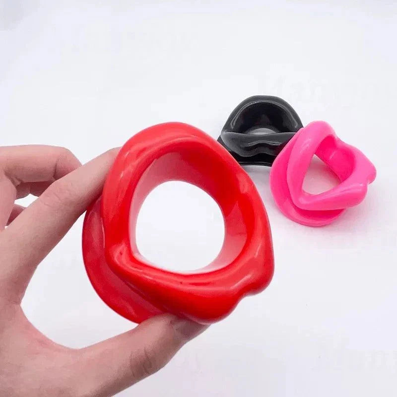 Soft harness mouth silicone dog-bone ball gag in red, pink, and black colors with adjustable bondage straps for comfortable restraint