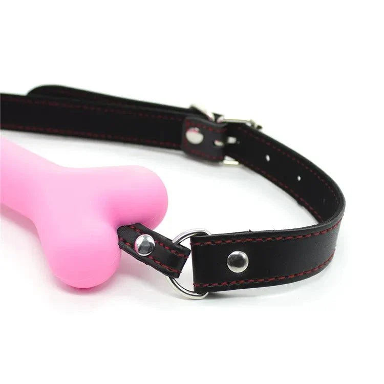 Adjustable soft harness mouth silicone dog-bone ball gag with black strap and pink bit for bondage restraint
