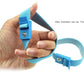 Adjustable blue electro shock conductive cock ring with elastic strap and safety buckle held in hand