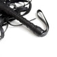 Close-up of black leather flogger whip for sensory bondage play and BDSM impact sensation.