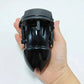 Electric Shock Penis Plug and Chastity Cage with urethral dilator held in hand, black adult toy for stimulation and restraint