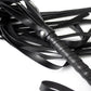 Close-up of black faux leather whip with multiple flexible strips and wrapped handle for BDSM impact play