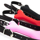 Soft harness mouth silicone dog-bone ball gags with adjustable black straps in black, red, and pink colors for comfortable bondage restraint