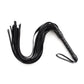 Black leather flogger whip with multiple tails and wrapped handle for sensory BDSM play