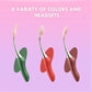 High-Frequency G-Spot Vibrator in green red and brown with multiple stimulation heads on pink background