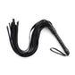 Black faux leather whip riding crop with multiple flexible tails and ergonomic handle for BDSM impact play
