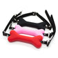 Soft harness mouth dog-bone ball gag in black, pink, and red silicone with adjustable straps for bondage restraint