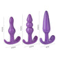 Set of three purple silicone anal plugs with varying sizes and shapes for BDSM play