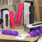 assorted 20-speed powerful AV vibrators in black, pink, and purple on wooden table with packaging and manuals next to a sofa